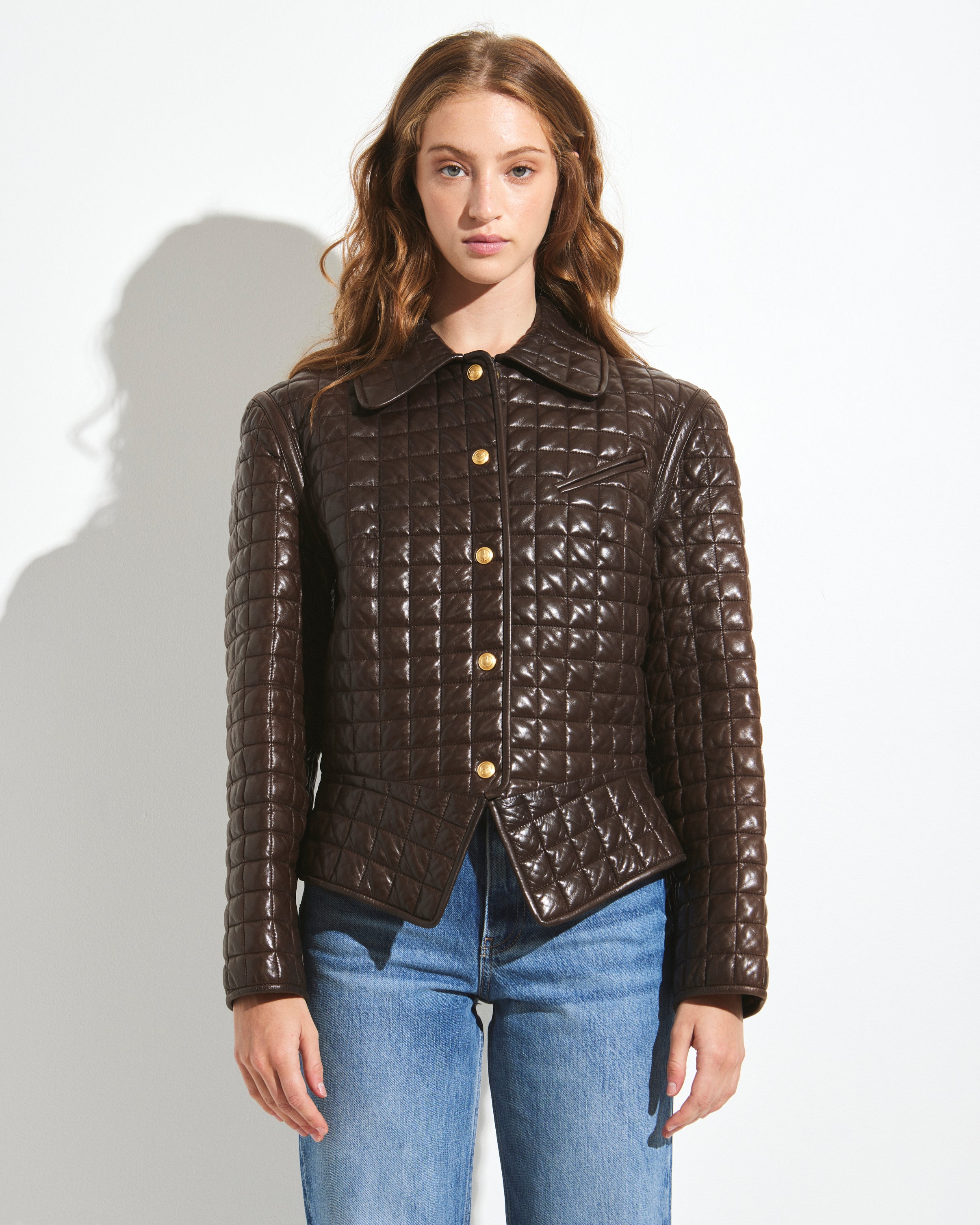 Lot 165 - A Gucci quilted brown leather jacket, modern